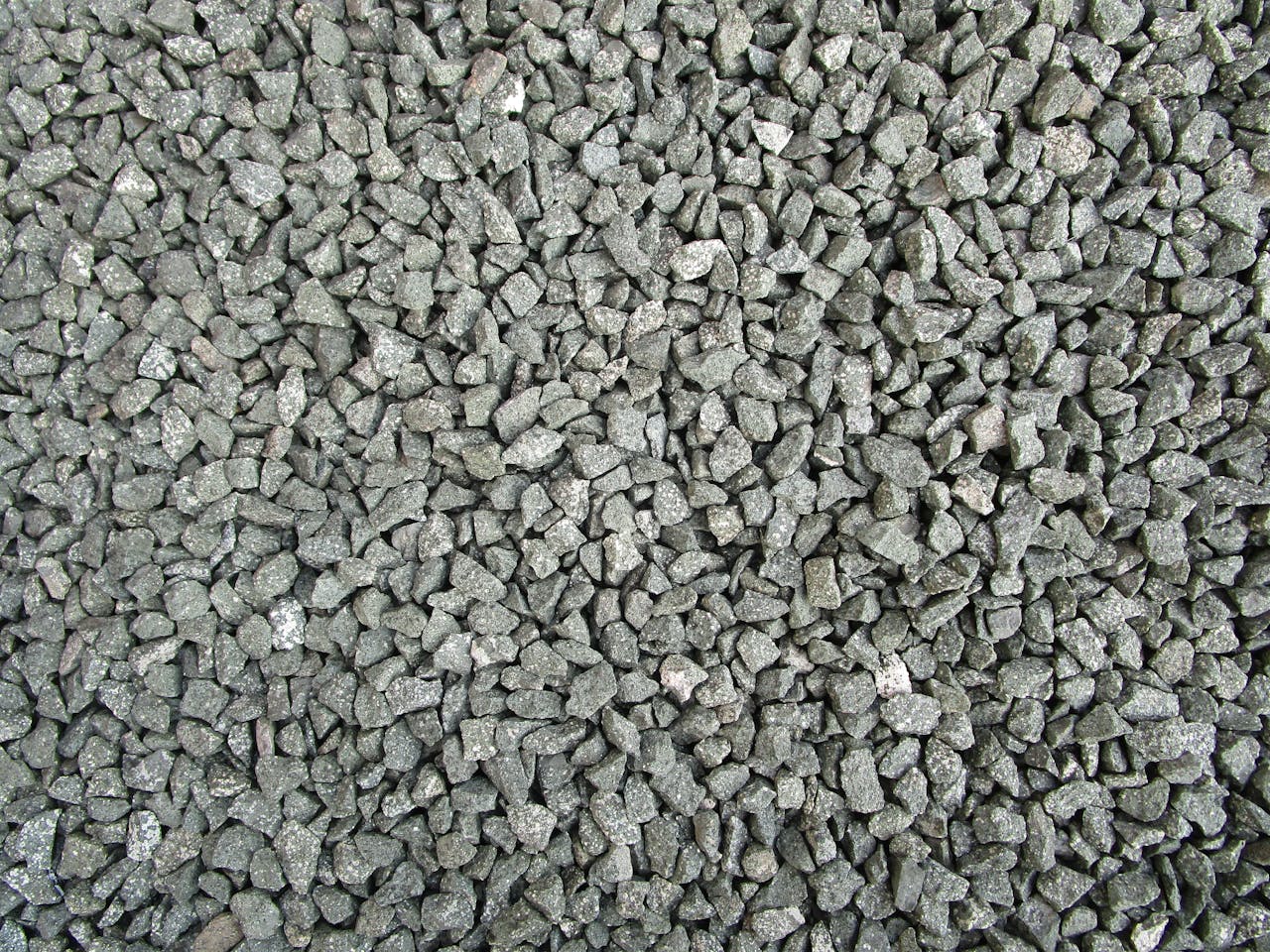 about-bg Detailed view of grey gravel stones commonly used in construction and landscaping.